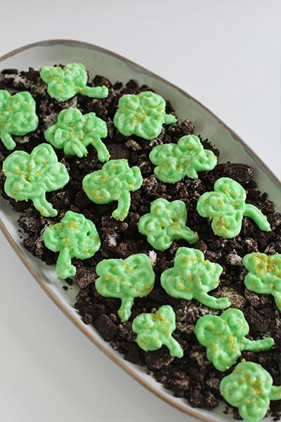 Shamrock Frozen Frosting Bites with Vanilla Frosting in serving dish