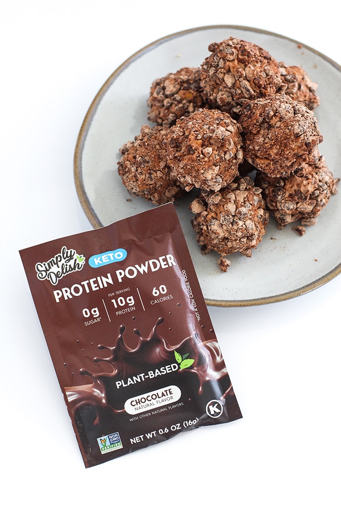 Chocolate Peanut Butter Keto Fat Bombs top view with Simply Delish Chooclate Protein Powder