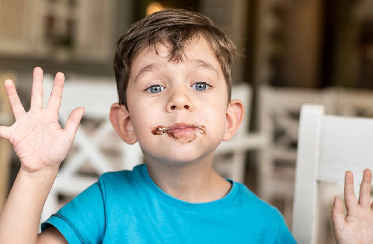 healthy desserts kids will love - child with pudding on his face