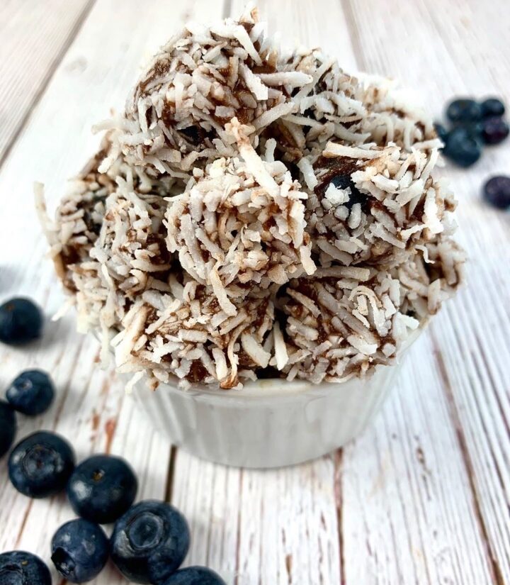 cup of blueberries with simply delish chocolate and coconut